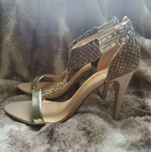 T-strap gold heels with animal print